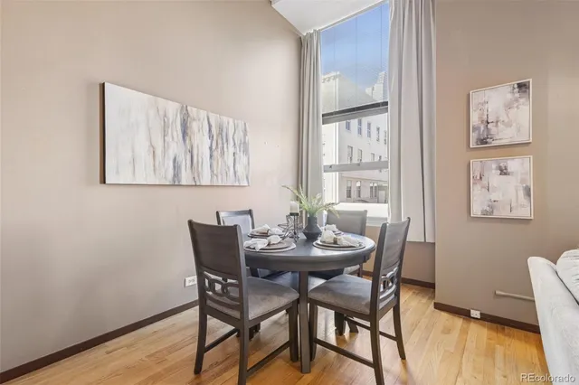 a view of a dining room with furniture and wooden floor