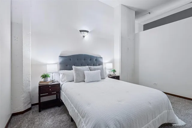 a bedroom with a bed and a view of bathroom