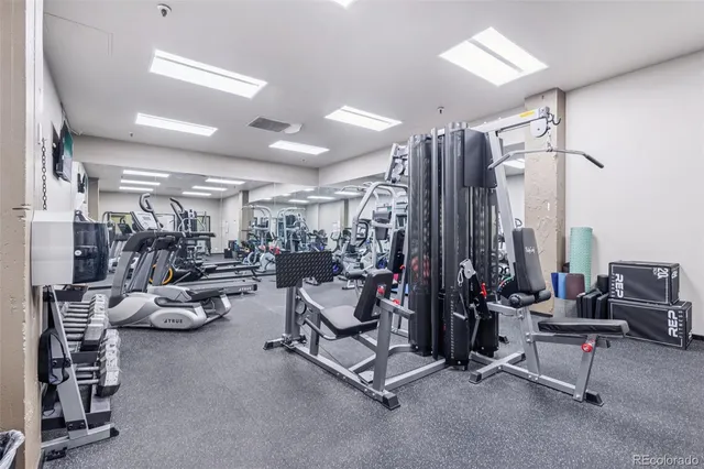 a view of gym room with gym equipment