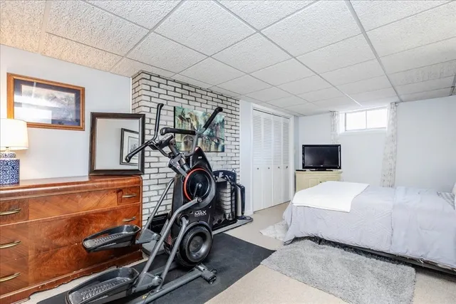 a room with gym equipment and a mirror
