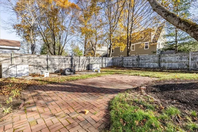 a view of a yard with swimming pool