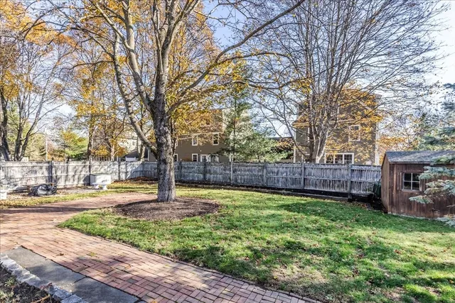 a house with lots of trees in the background