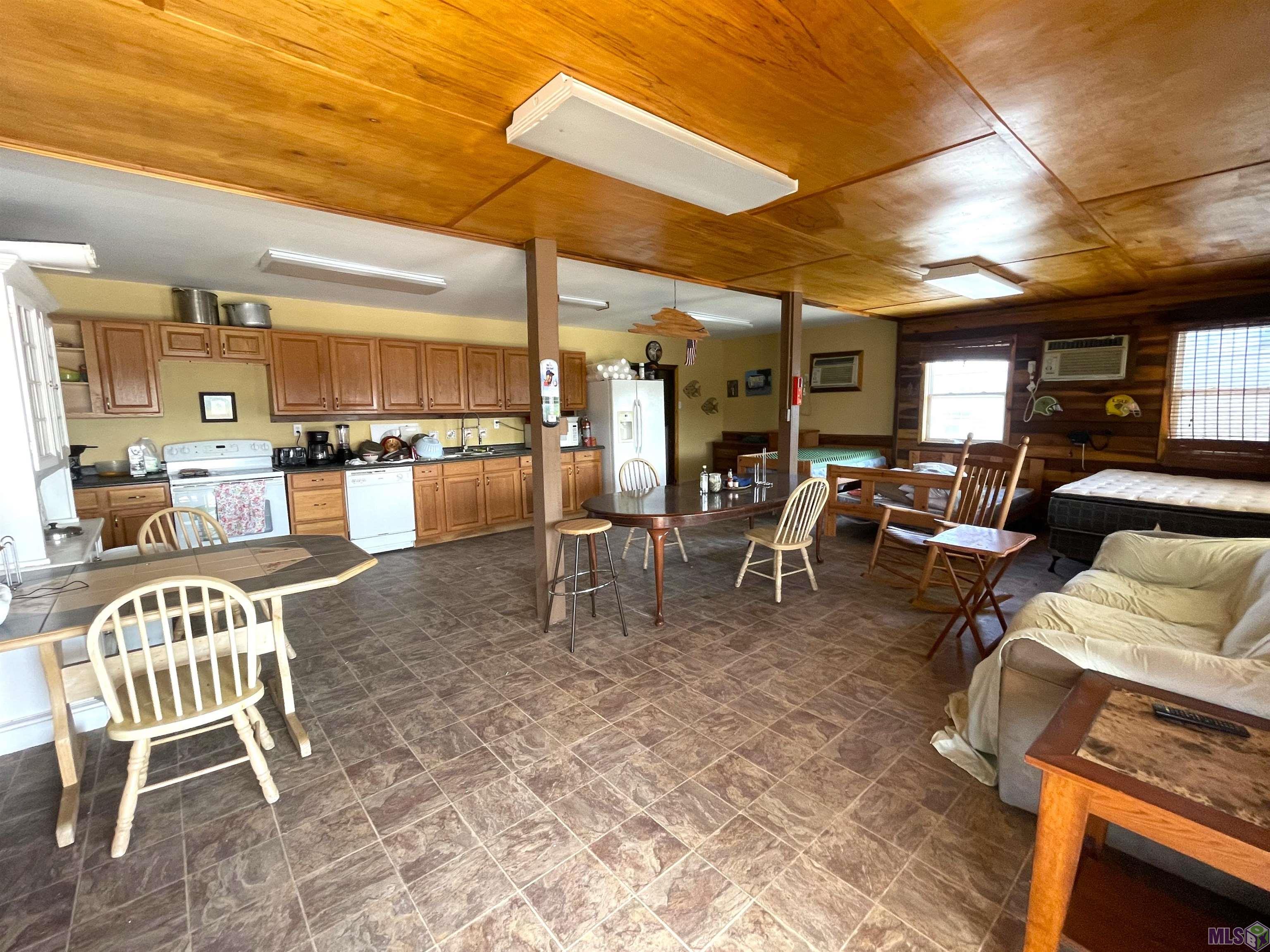 1031 Four Point Road Dulac, LA 70353 - Photo 3 of 12 living area and kitchen