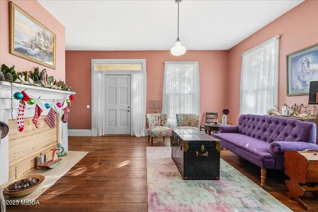 a living room with furniture and a window