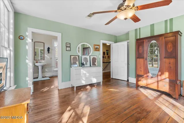 a living room with furniture and a chair