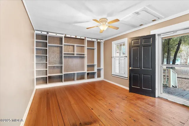 a bathroom with a toilet a sink and a mirror