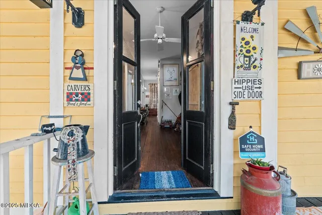 a view of an entryway with wooden floor