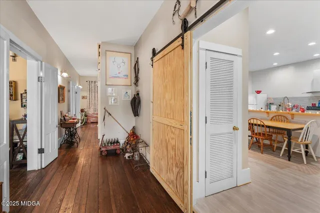 a kitchen with a table and chairs in it