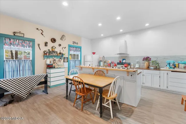 a kitchen with stainless steel appliances a sink and a refrigerator