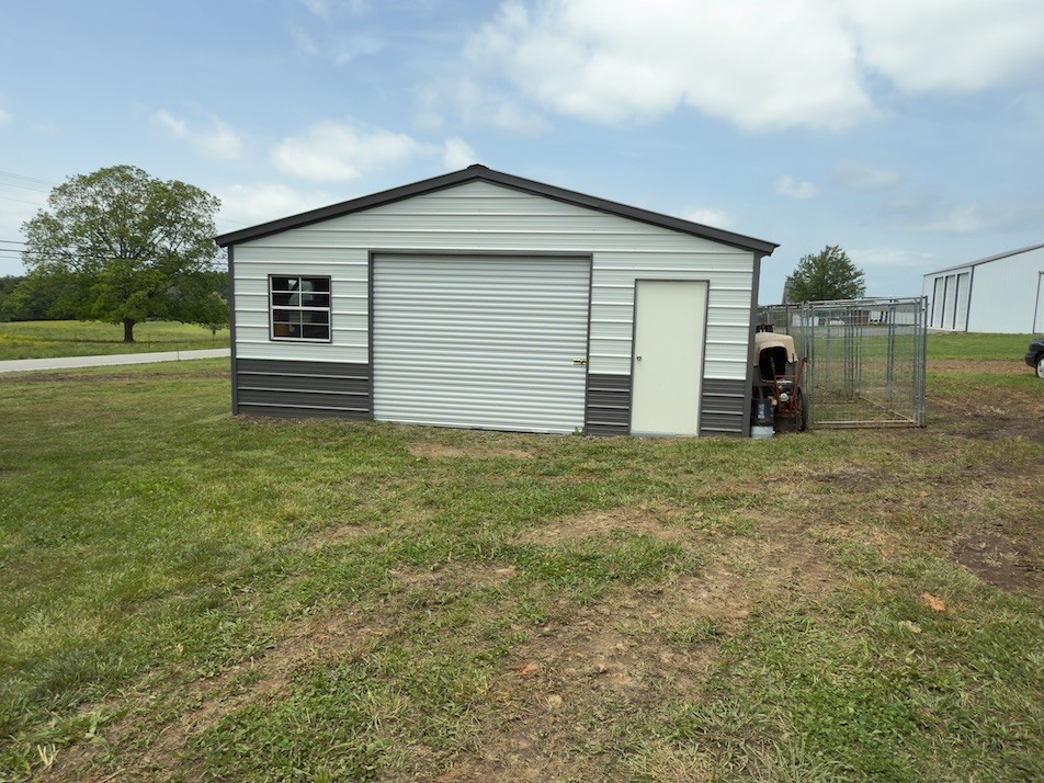 15 Joe Blanton Road Woodbury, TN 37190 - Photo 2 of 15 a front view of a house with garden
