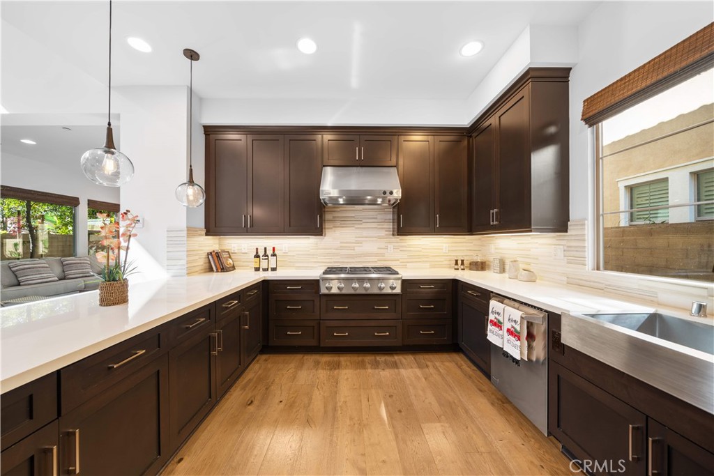105 Newall Irvine, CA 92618 - Photo 11 of 59 a large kitchen with granite countertop a stove and a sink