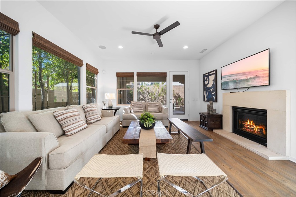 105 Newall Irvine, CA 92618 - Photo 17 of 59 a living room with furniture and a fireplace