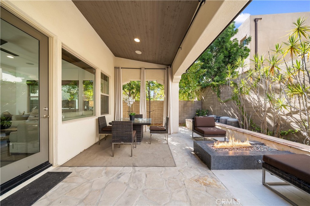105 Newall Irvine, CA 92618 - Photo 19 of 59 a patio with patio couch and table