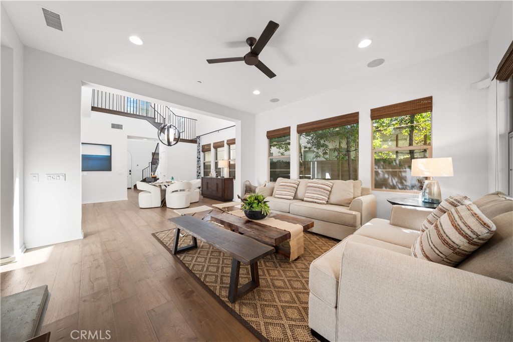 105 Newall Irvine, CA 92618 - Photo 25 of 59 a living room with furniture floor to ceiling window and wooden floor