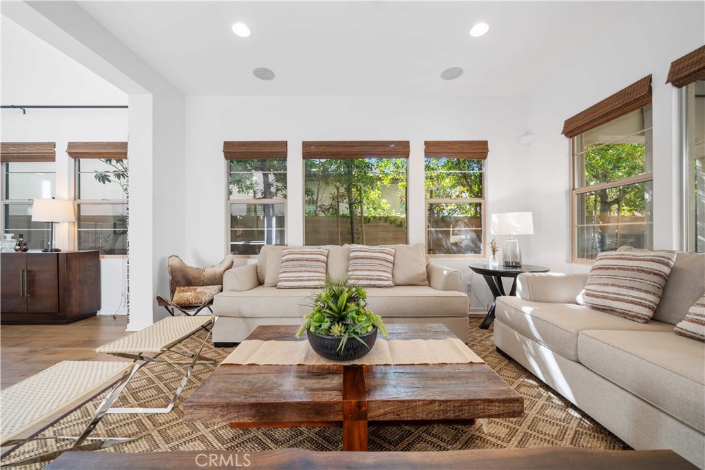 105 Newall Irvine, CA 92618 - Photo 26 of 59 a living room with furniture large windows and wooden floor