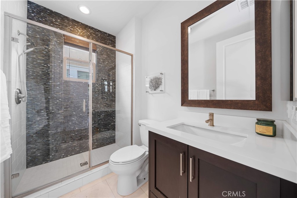 105 Newall Irvine, CA 92618 - Photo 27 of 59 a bathroom with a sink a toilet and shower