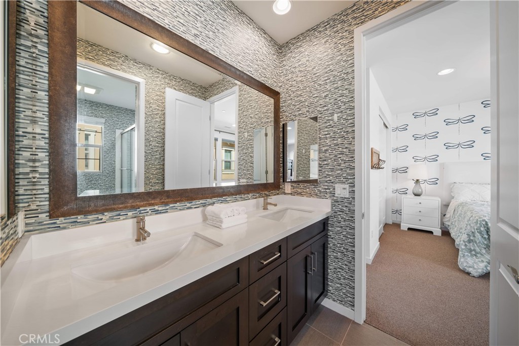 105 Newall Irvine, CA 92618 - Photo 37 of 59 a spacious bathroom with a sink double vanity and a mirror