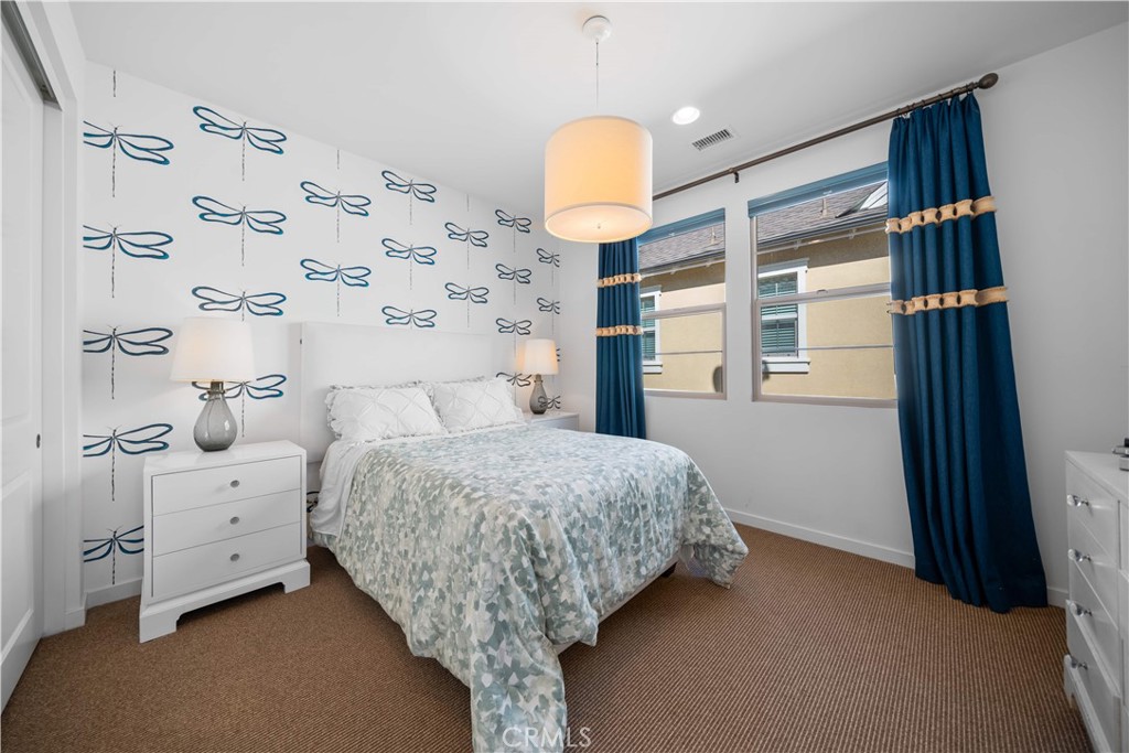 105 Newall Irvine, CA 92618 - Photo 40 of 59 a bedroom with a bed and a window