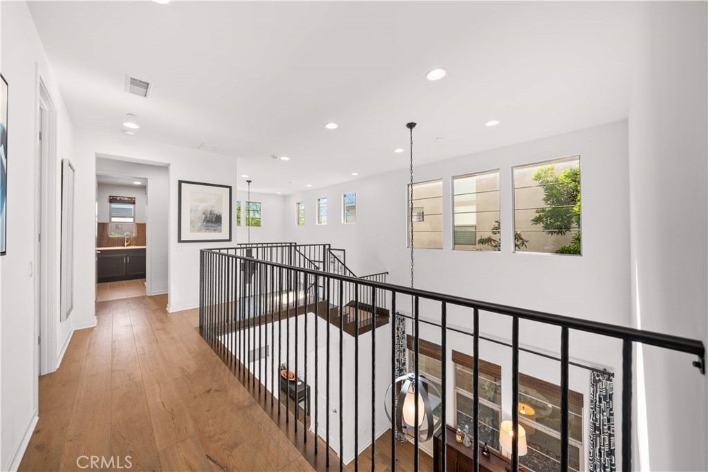 105 Newall Irvine, CA 92618 - Photo 42 of 59 a view of hallway with wooden floor and windows