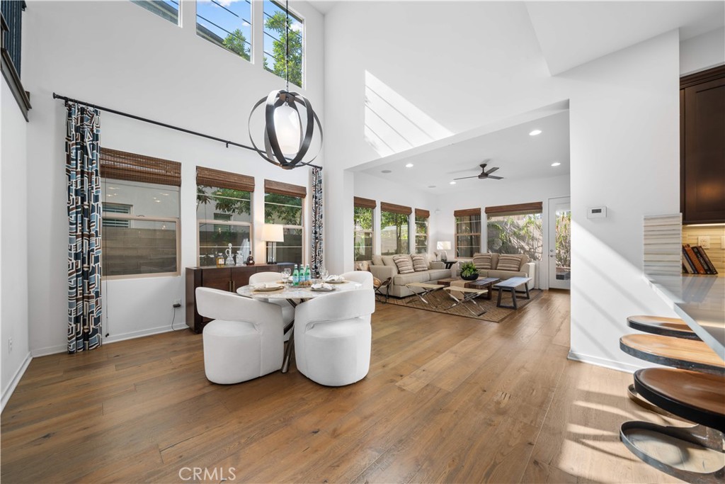 105 Newall Irvine, CA 92618 - Photo 10 of 59 a living room with furniture a large window and wooden floor
