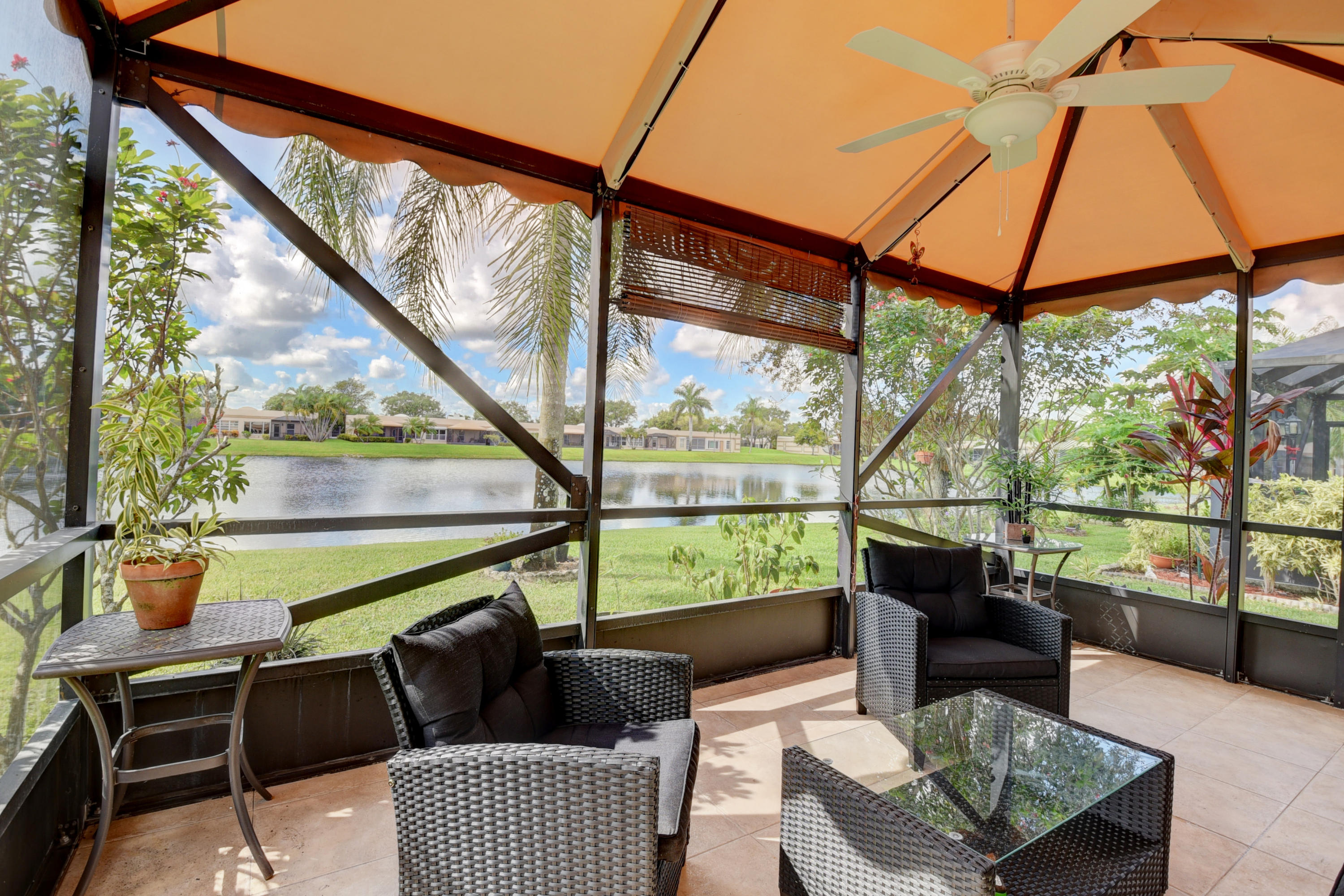 9094 Flynn Circle, Unit 1 Boca Raton, FL 33496 - Photo 1 of 23 Expanded Patio Overlooking Lake