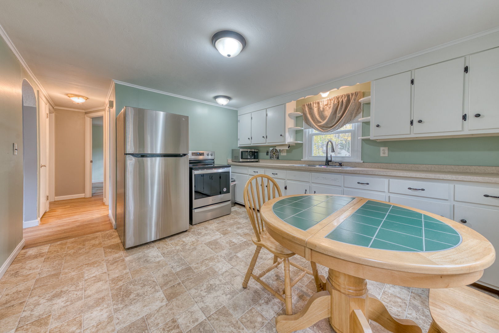 3 Avon St Extension Enfield, CT 06082 - Photo 11 of 16 a kitchen with stainless steel appliances granite countertop a sink refrigerator and cabinets