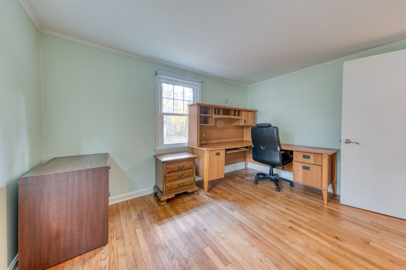 3 Avon St Extension Enfield, CT 06082 - Photo 6 of 16 a view of a workspace with furniture and a window