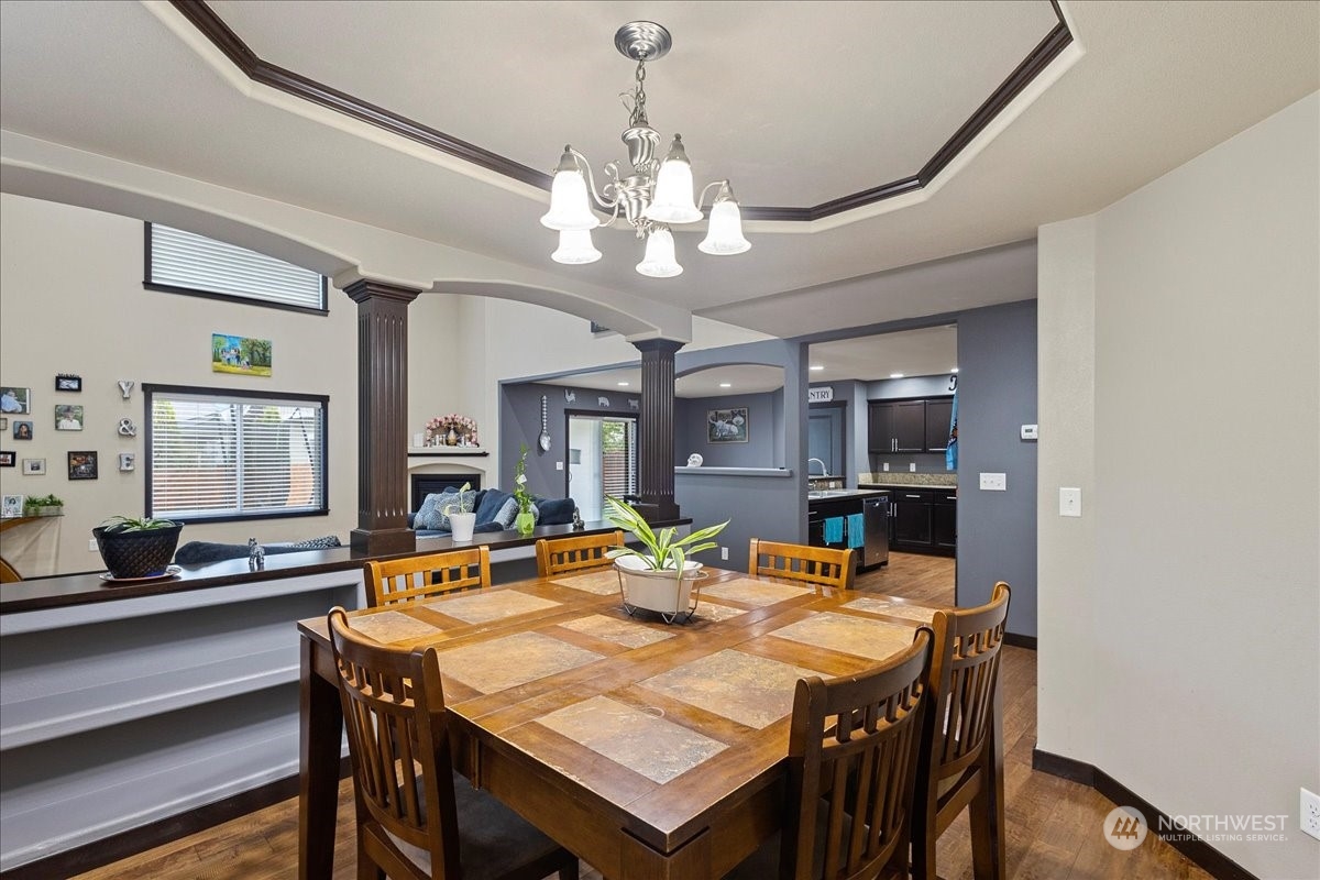 431 Barry Loop Mount Vernon, WA 98274 - Photo 15 of 32 a view of a dining room with furniture and a chandelier