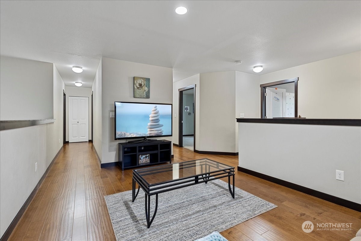 431 Barry Loop Mount Vernon, WA 98274 - Photo 19 of 32 a living room with furniture and a wooden floor