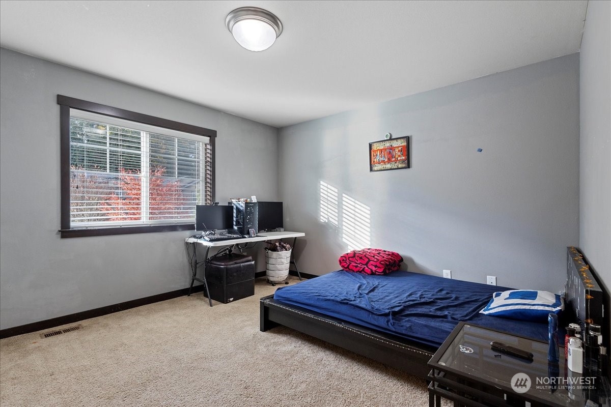 431 Barry Loop Mount Vernon, WA 98274 - Photo 20 of 32 a bedroom with furniture and a window