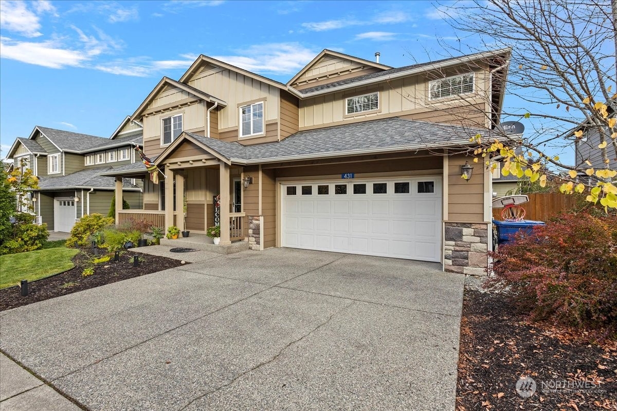 431 Barry Loop Mount Vernon, WA 98274 - Photo 2 of 32 a front view of a house with a yard and garage