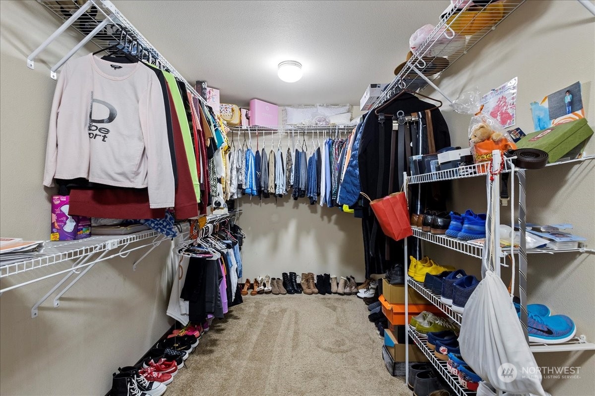 431 Barry Loop Mount Vernon, WA 98274 - Photo 27 of 32 a view of walk in closet with clothes and shoes