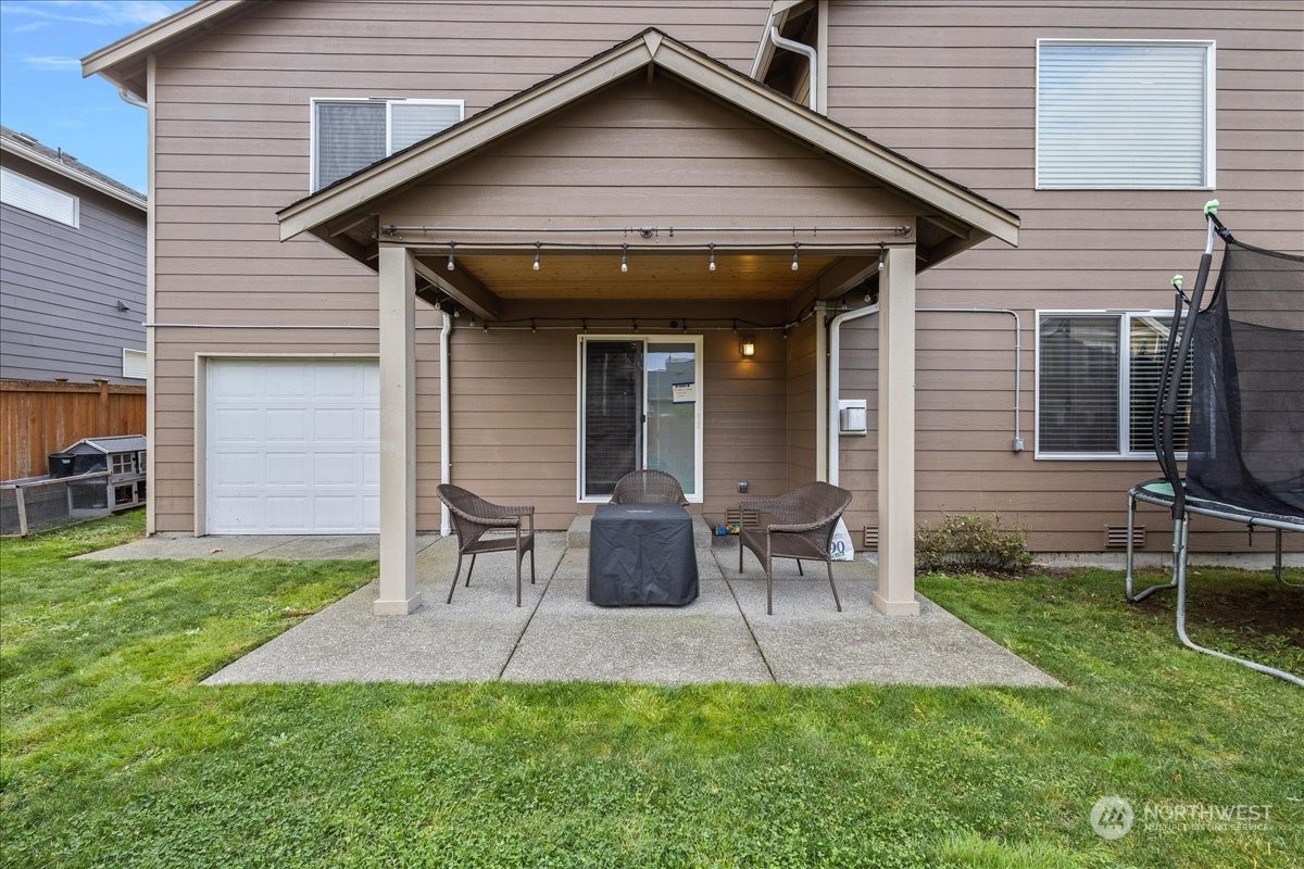 431 Barry Loop Mount Vernon, WA 98274 - Photo 31 of 32 a front view of a house with a yard and outdoor seating