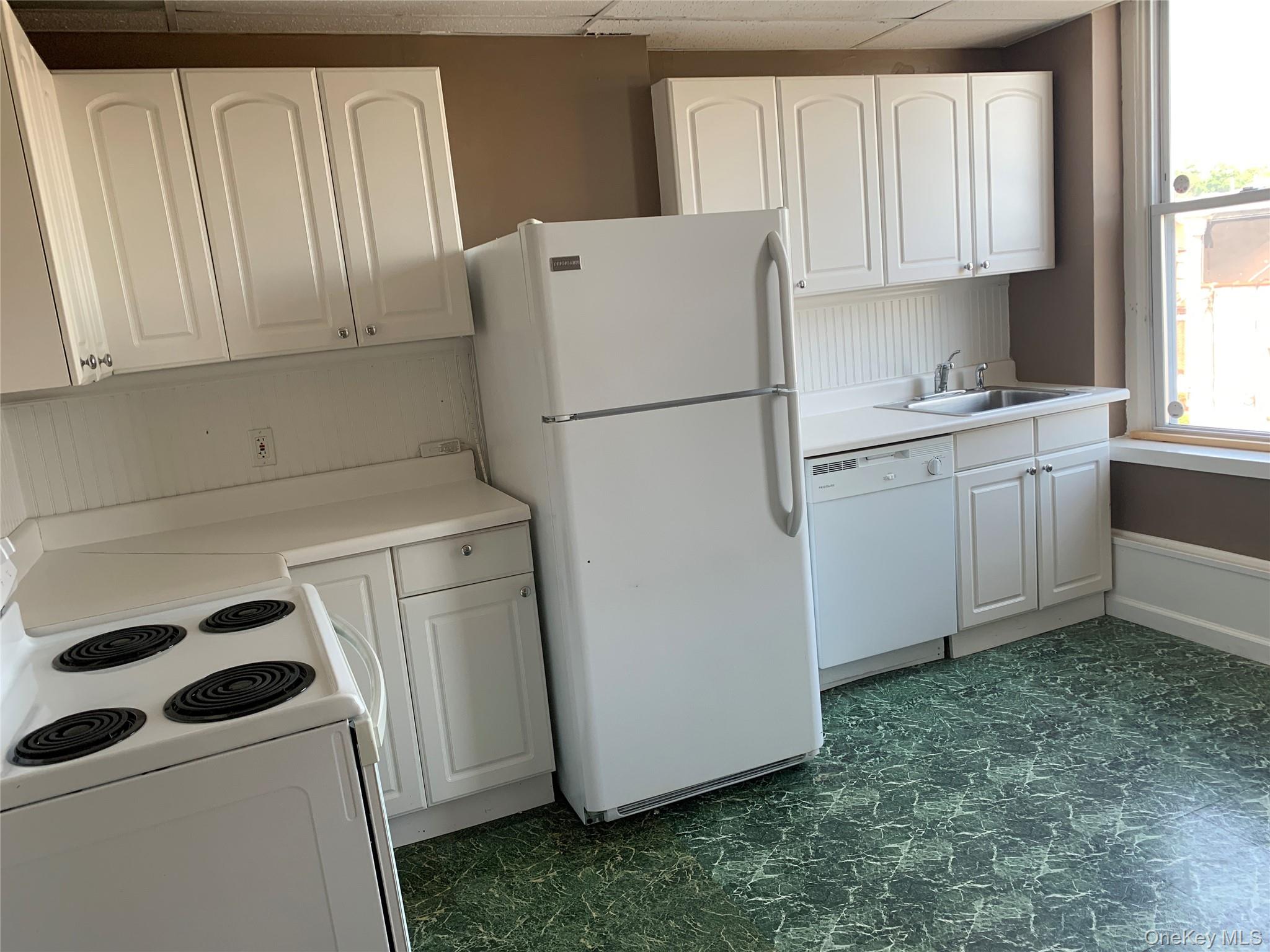 249 Main Street, Unit WEST Huntington, NY 11743 - Photo 3 of 6 a utility room with dryer and washer