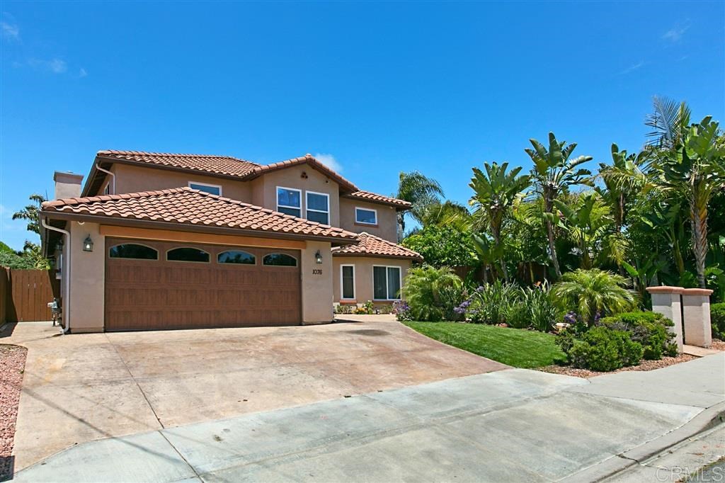 1076 Melba Road Encinitas, CA 92024 - Photo 1 of 1 a front view of a house with a yard