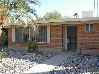 7316 East Random Ridge Drive Tucson, AZ 85710 - Photo 1 of 10 a front view of a house