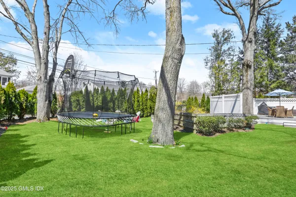 a view of a table and chairs in the garden