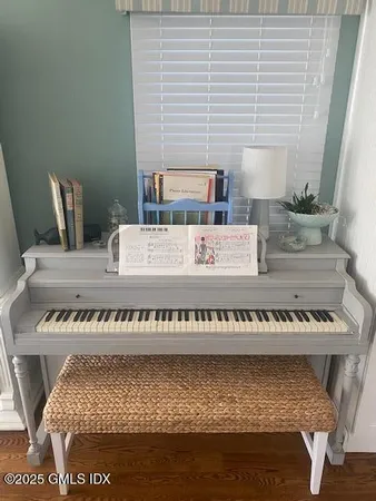 a view of a bedroom with furniture