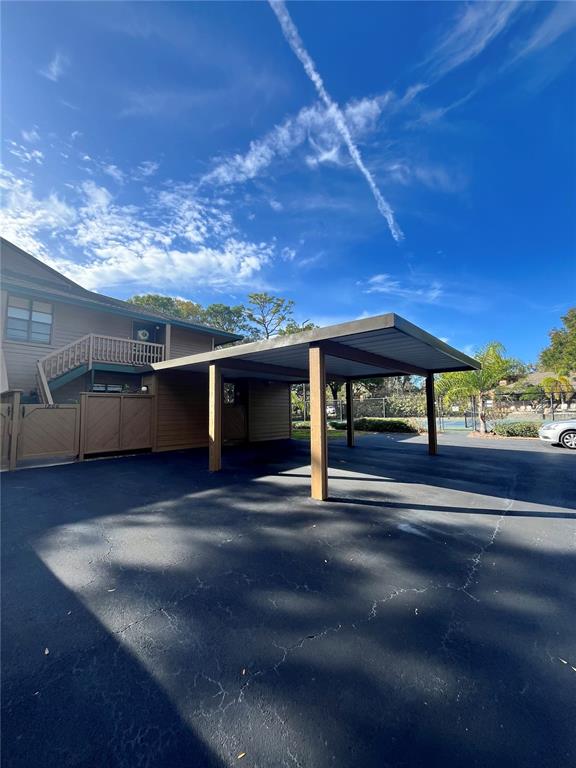 1805 Lennox Road East, Unit 1805 Palm Harbor, FL 34683 - Photo 1 of 15 a view of a porch