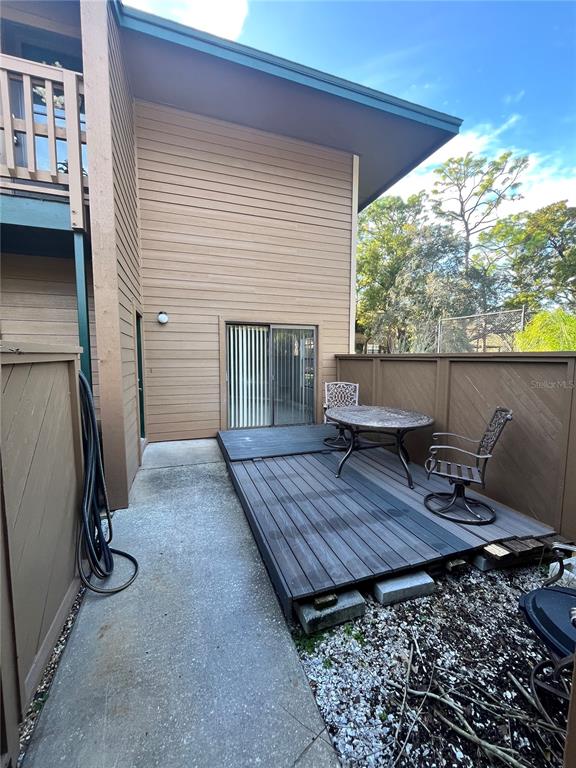 1805 Lennox Road East, Unit 1805 Palm Harbor, FL 34683 - Photo 13 of 15 a view of a deck with wooden floor and seating space