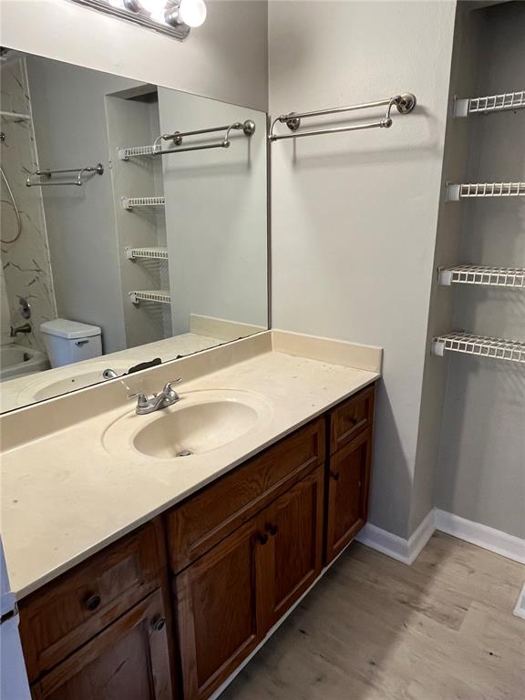 1805 Lennox Road East, Unit 1805 Palm Harbor, FL 34683 - Photo 9 of 15 a bathroom with a sink and a mirror