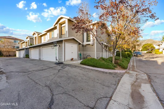 a view of a large house with a large trees
