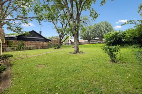 a view of a backyard with a garden