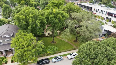 an aerial view of a house with yard swimming pool and outdoor seating