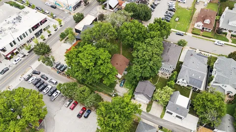 an aerial view of a house with a yard and garden