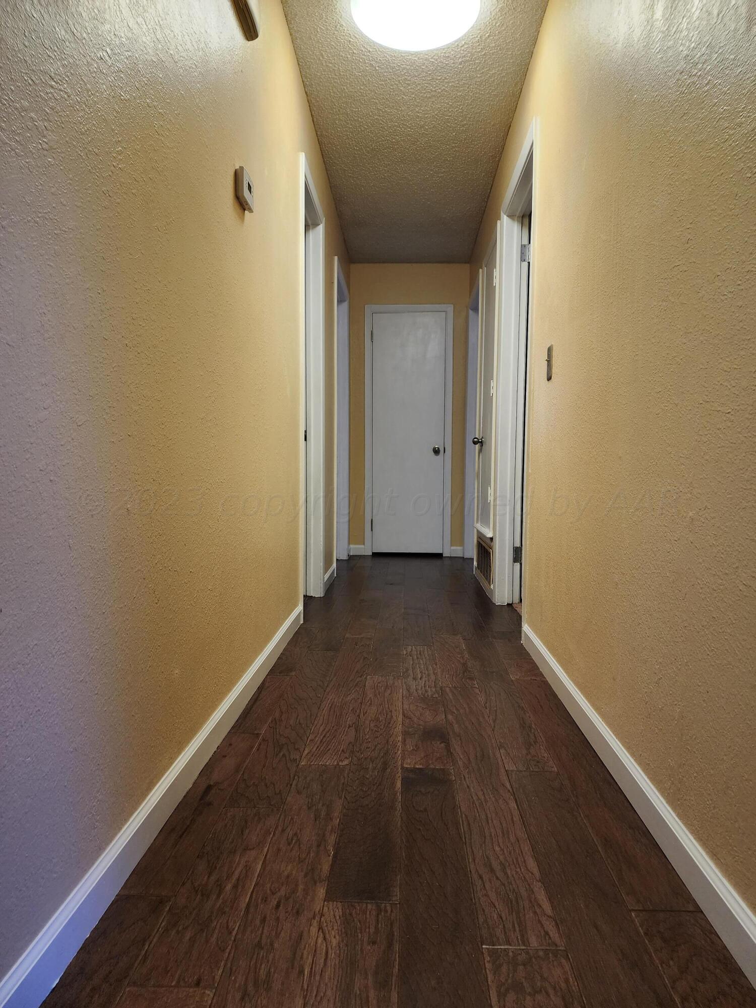 6523 Garwood Road Amarillo, TX 79109 - Photo 17 of 30 hall to bedrooms