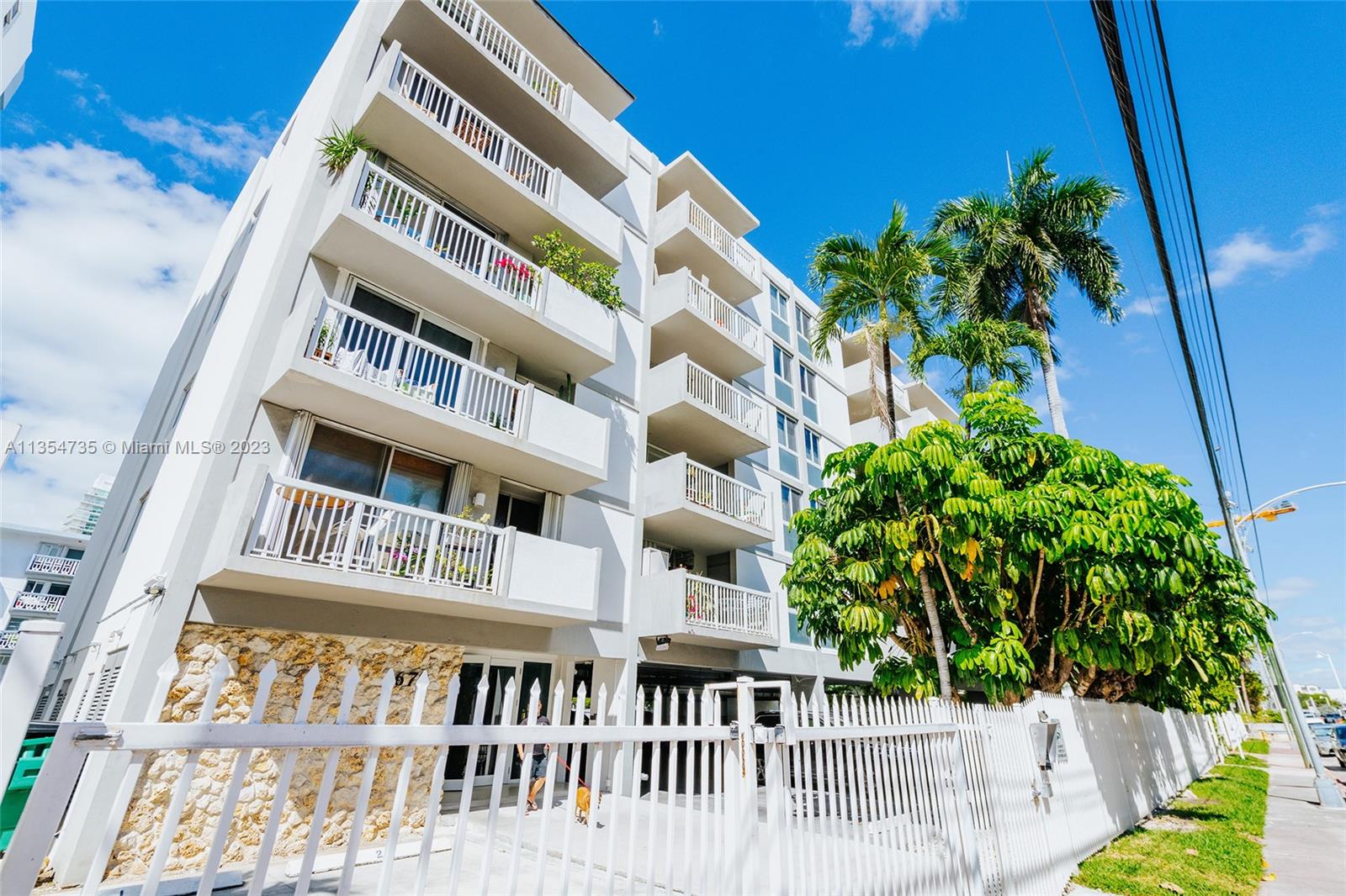 1670 Bay Road, Unit 4F Miami Beach, FL 33139 - Photo 12 of 12 a balcony with book plants and wooden fence