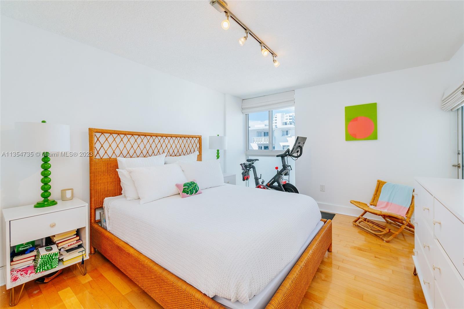 1670 Bay Road, Unit 4F Miami Beach, FL 33139 - Photo 9 of 12 a bed room with a bed and a couch