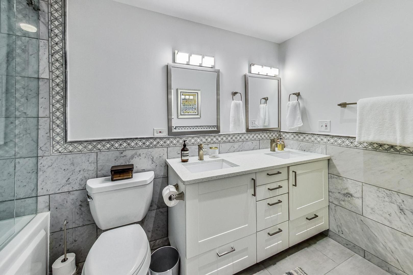 811 South Lytle Street, Unit 611 Chicago, IL 60607 - Photo 12 of 29 a bathroom with a toilet sink and mirror