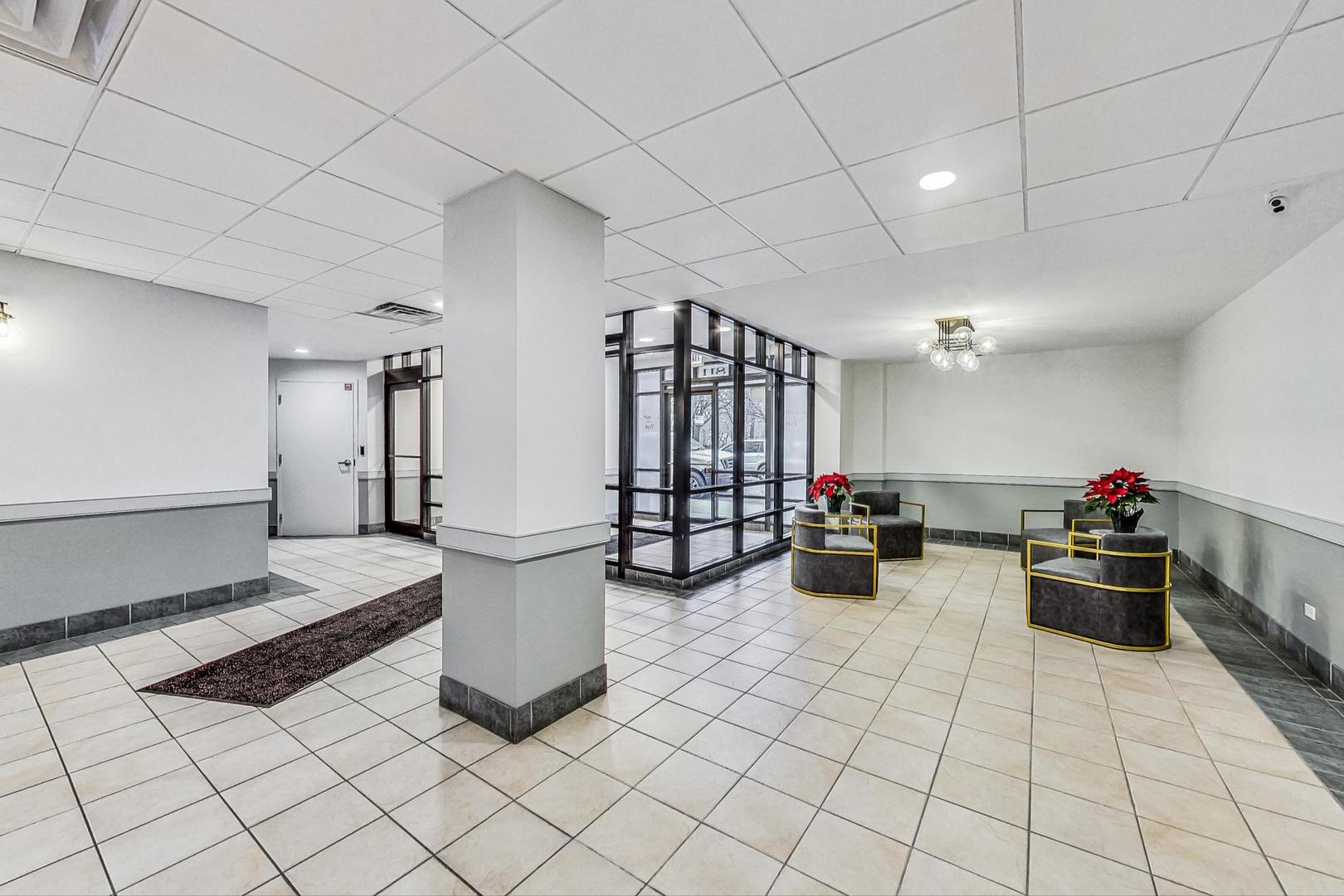 811 South Lytle Street, Unit 611 Chicago, IL 60607 - Photo 2 of 29 a view of a room with lots of white furniture and wooden floor